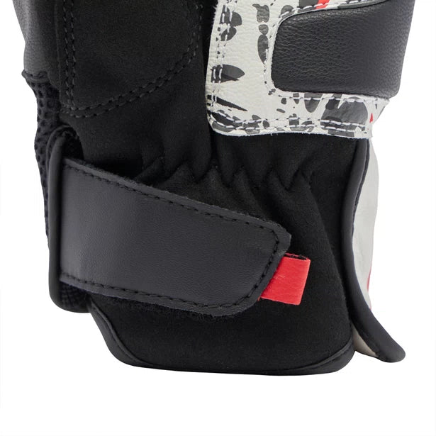 Rider wearing Dainese Mig 3 gloves on motorcycle handlebar