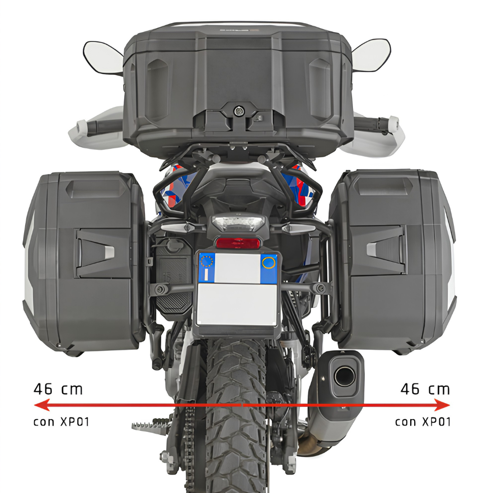Rear view of a motorcycle with dark gray pannier bags and a large top box, overlaid with a red horizontal measurement arrow and text indicating 46 cm on each side with reference to XP01.