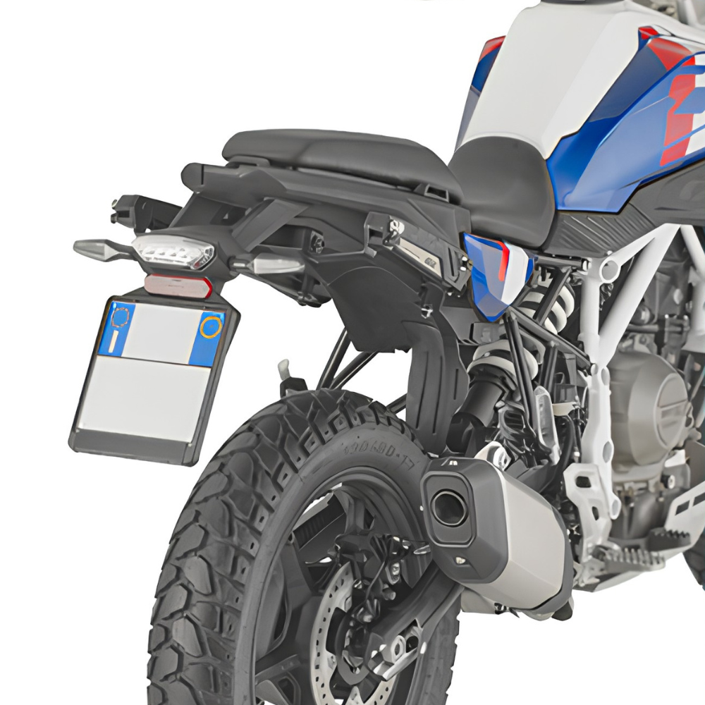 Black Givi motorcycle luggage set including side bags, a top box, and a rear rack bag, shown on a white and blue motorcycle against a white background.