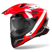 Red and black motorcycle helmet with visor on a white background