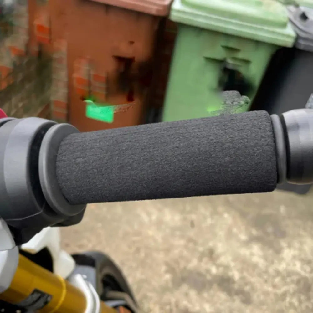 Motorcycle grip puppy sleeve reducing hand fatigue