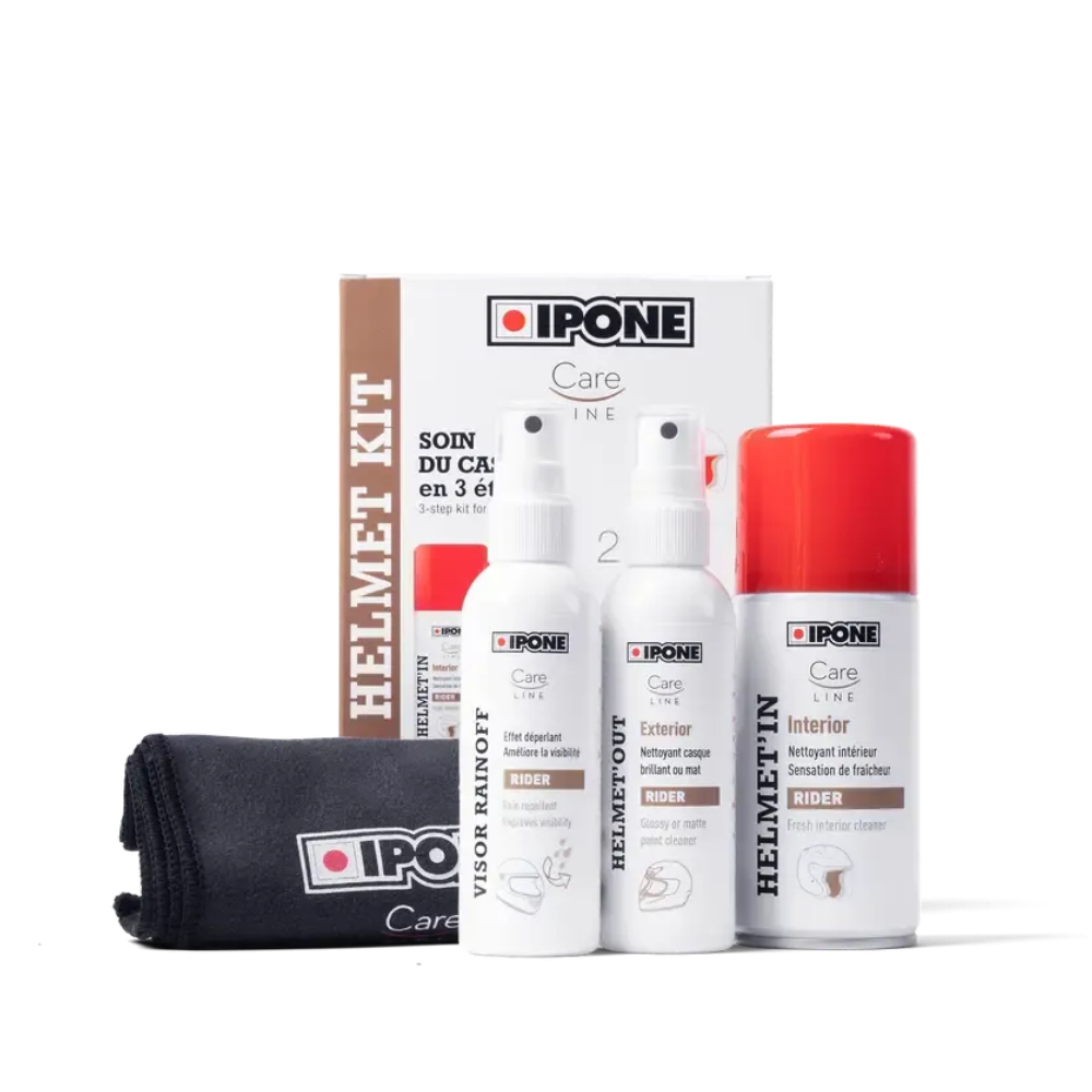 IPONE Helmet Care Kit with three white bottles (visor rainoff, helmet out, and interior cleaner), a red-capped spray can, a brown and white box, and a black microfiber cloth on a white background.