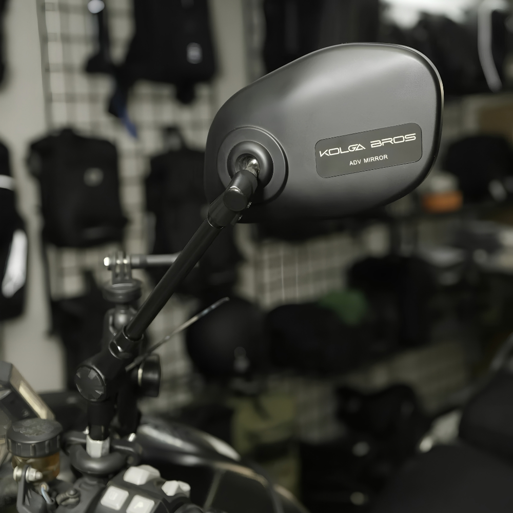 Kolga Bros ADV Mirror mounted on a motorcycle handlebar