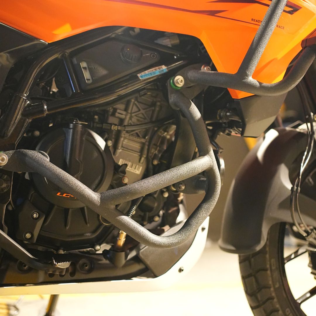 Sturdy KTM 250/390 X-ADV crash guard mounted for maximum impact resistance