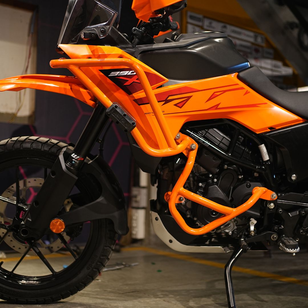 Orange crash guard on KTM 250/390 X-ADV for a bold and stylish look