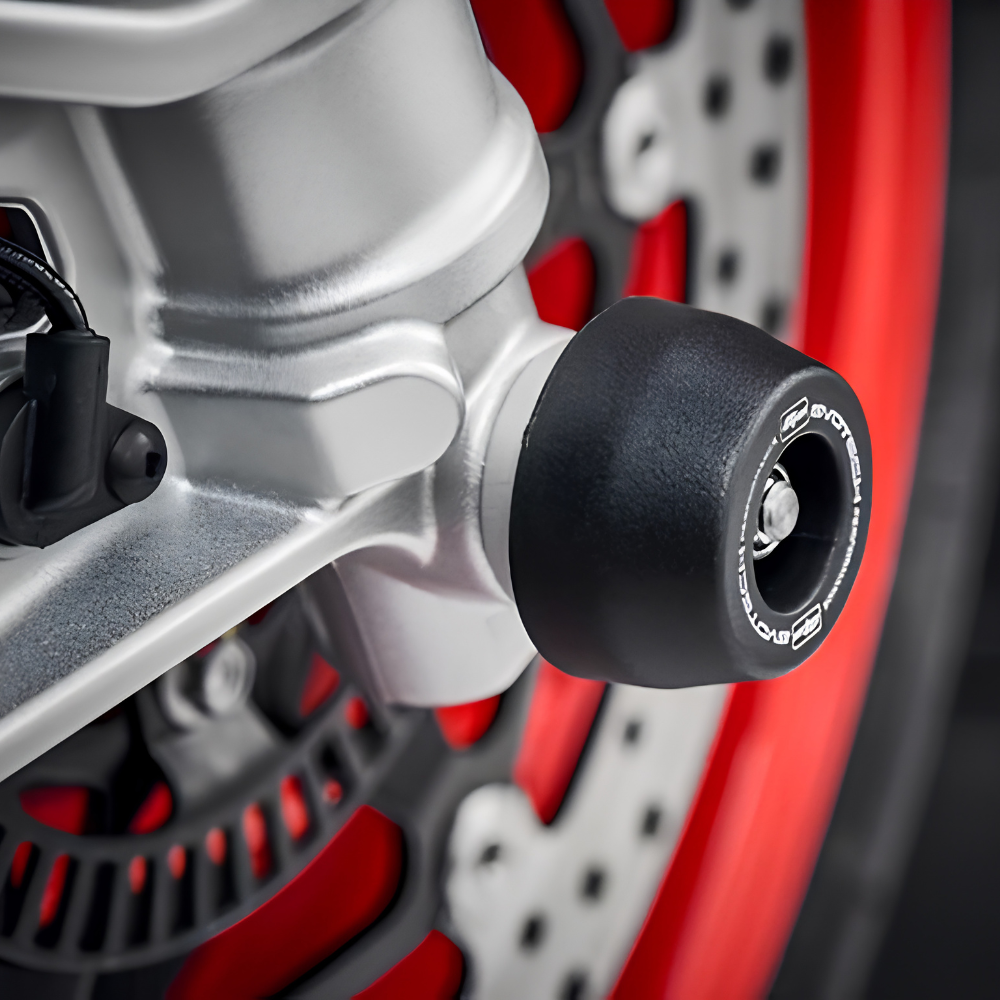 Close-up of Evotech nylon bobbin head and aluminium spacer for Aprilia RS 660