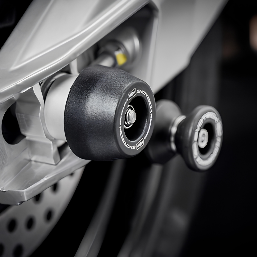 Close-up of Evotech nylon bobbin and aluminium base swingarm protector