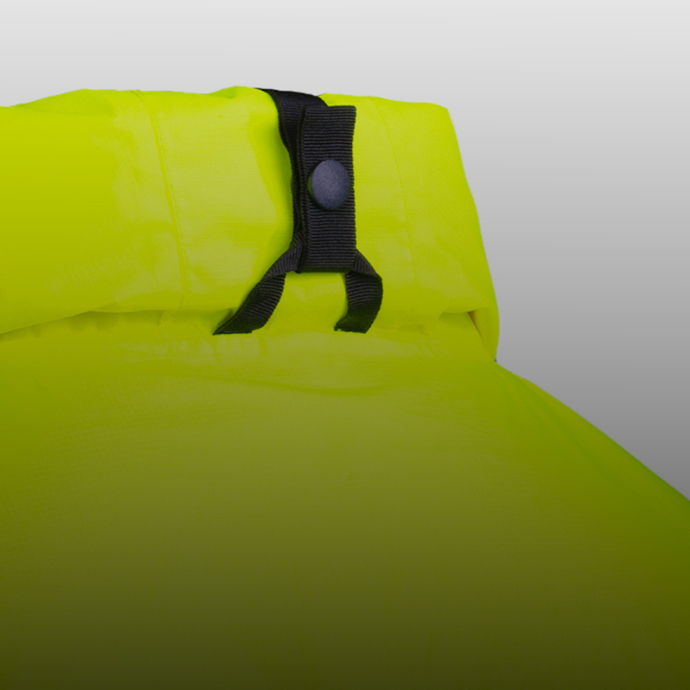 Close-up of a bright neon yellow-green waterproof bag with a black strap and snap closure, set against a neutral gray gradient background.