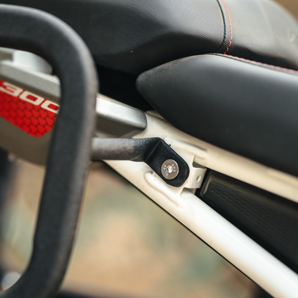 Prevents luggage from contacting wheel or exhaust
